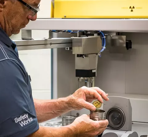 A technician runs a lab sample on an in-house testing apparatus