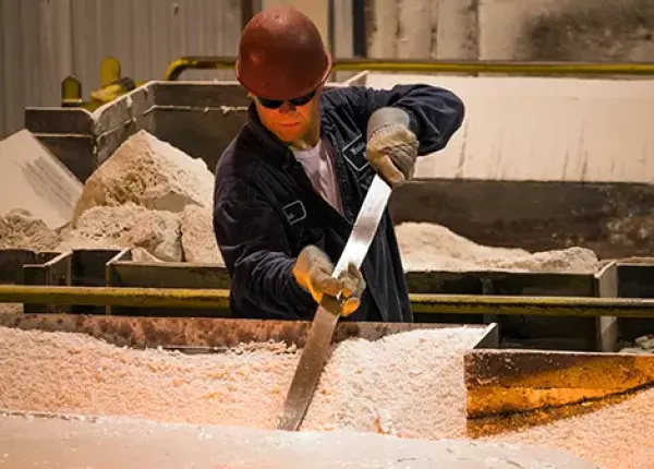 A furnace technician tests chemistry