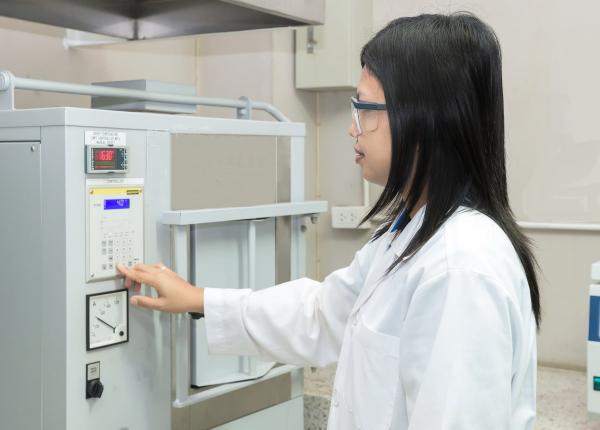 technician at a muffle furnace