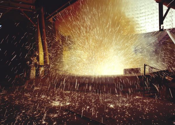 Washington Mills Furnace attendant with sparks